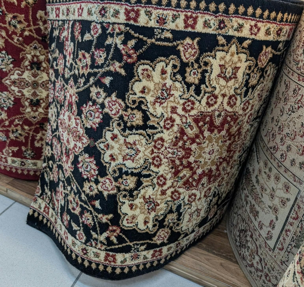 Rouleau du tapis de passage Antalia noir en magasin