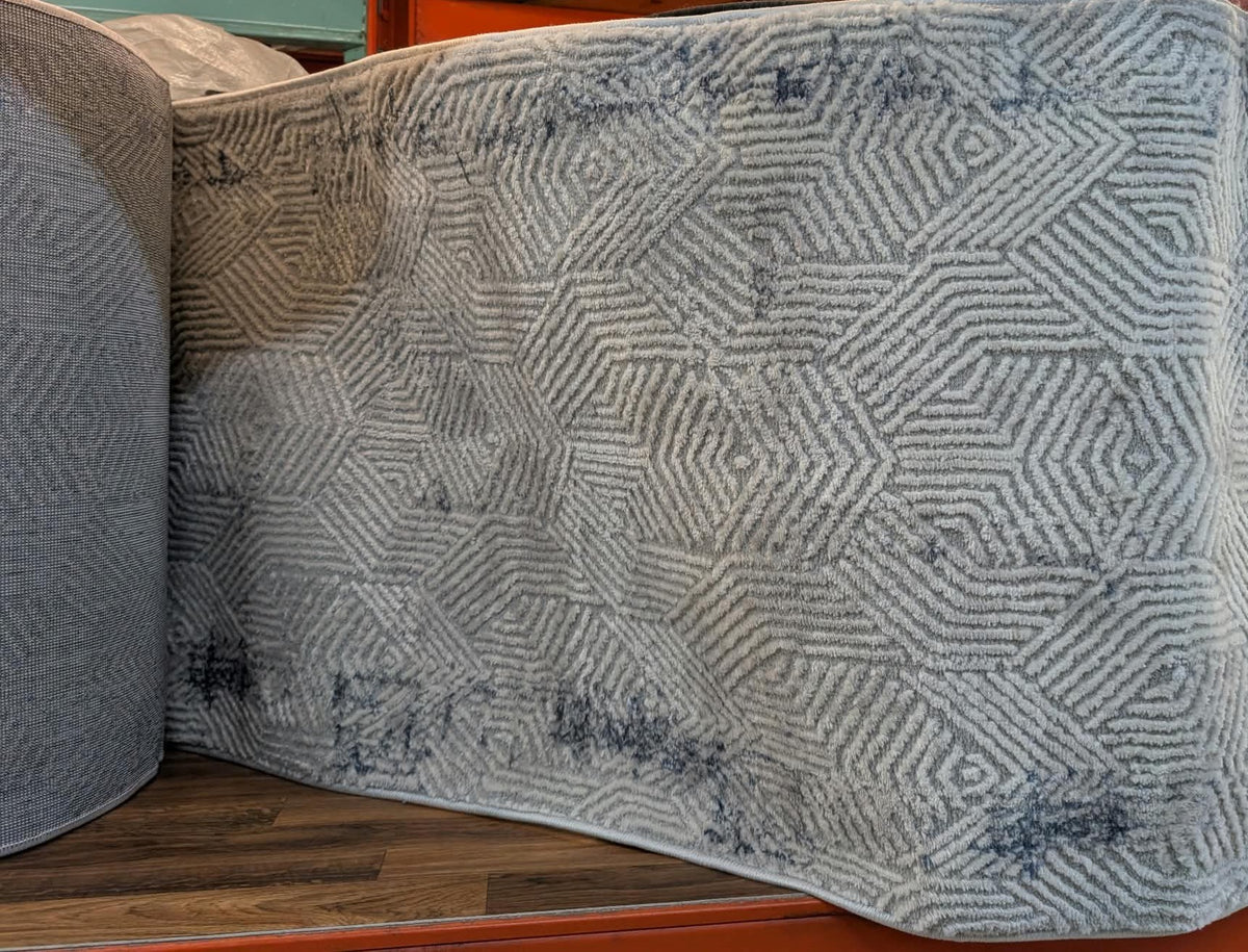 Rouleau du tapis de passage Symphoni géométrique en magasin
