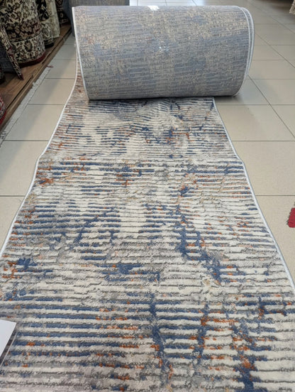 Tapis de passage Symphoni rayures déroulé en magasin